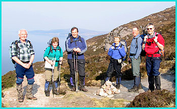 From left to right - Barry, Julie, Andrew, Pam, Dave and Paul - in a jolly mood as they set off along the lovely coastal path to Scoraig in the sun on a day that forecast rain