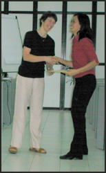 Awarding certificate to Ellyana